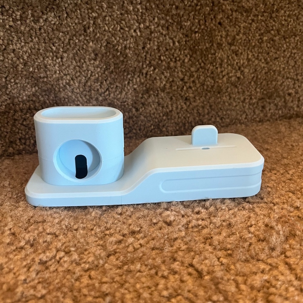 Light Blue Charging Dock for Apple Watch, AirPods, and phone.